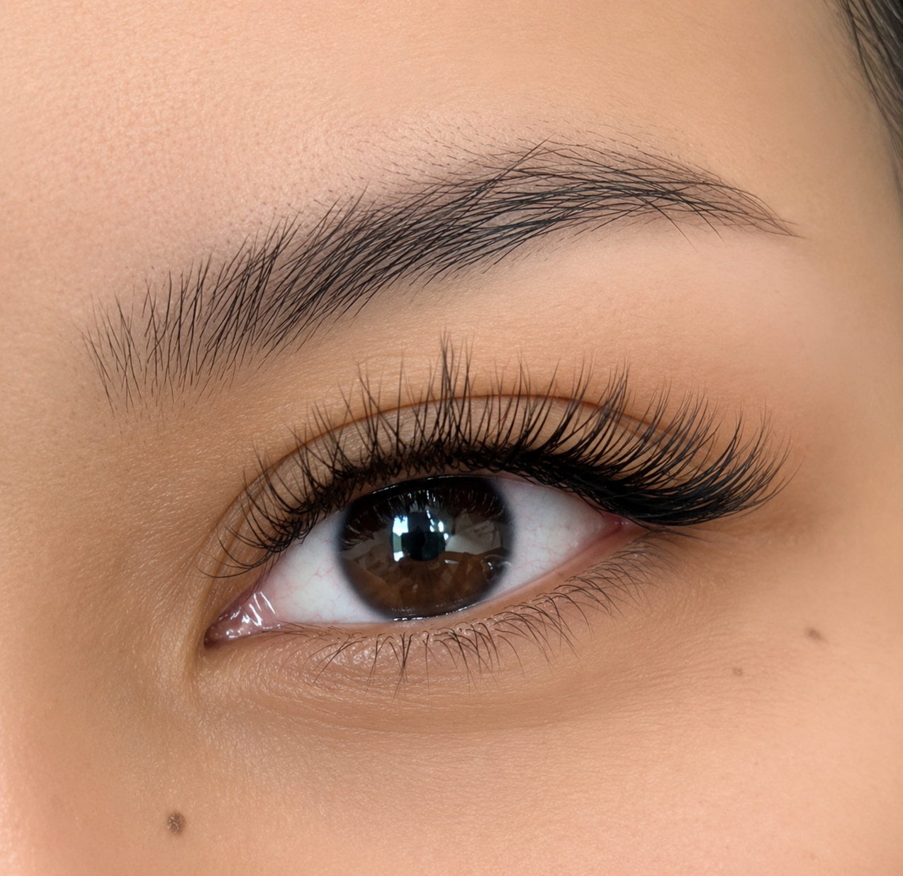 Classic natural lash extensions on a single eye